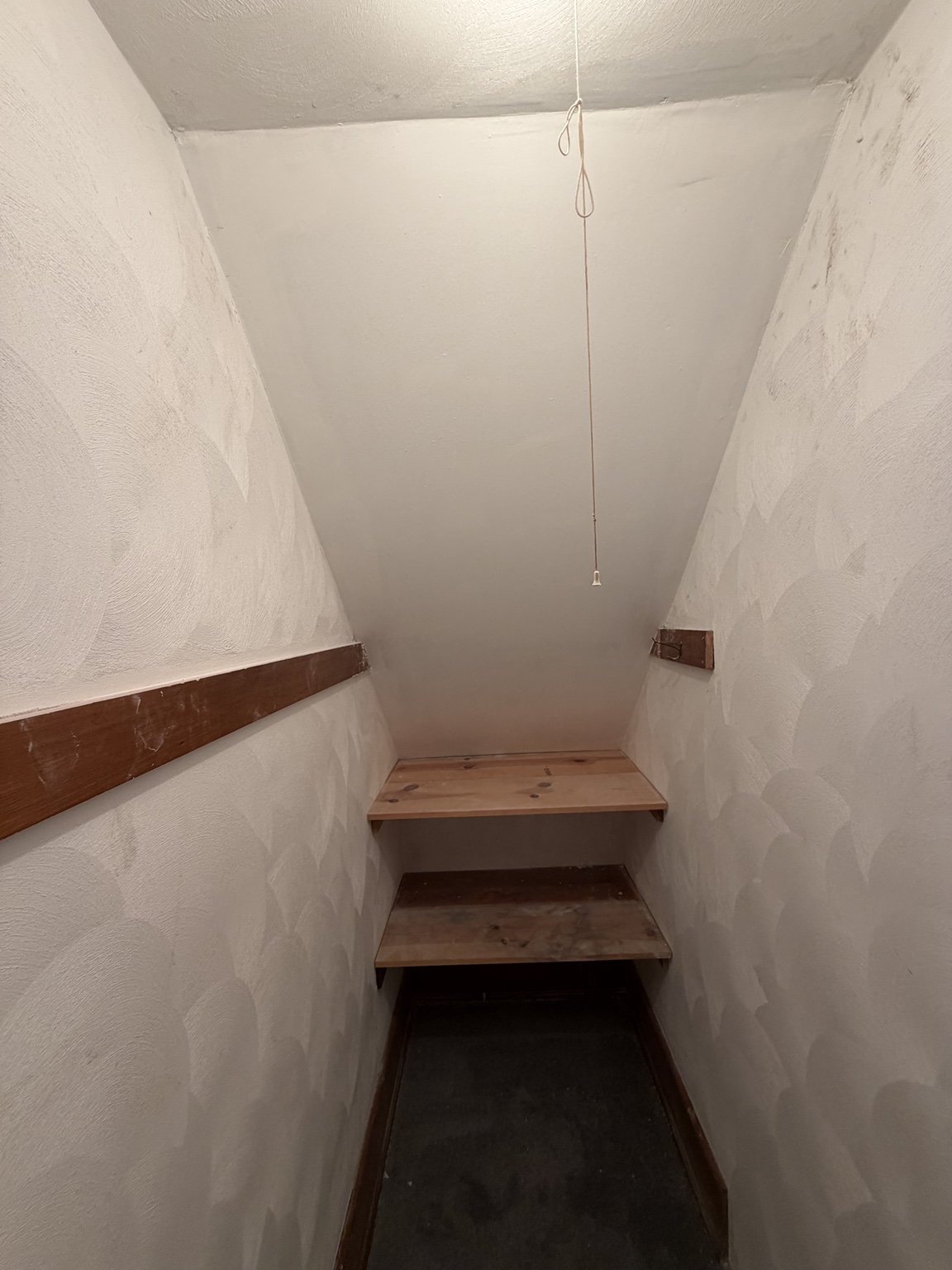 The same stairwell with the damaged end wall repaired and refinished.
